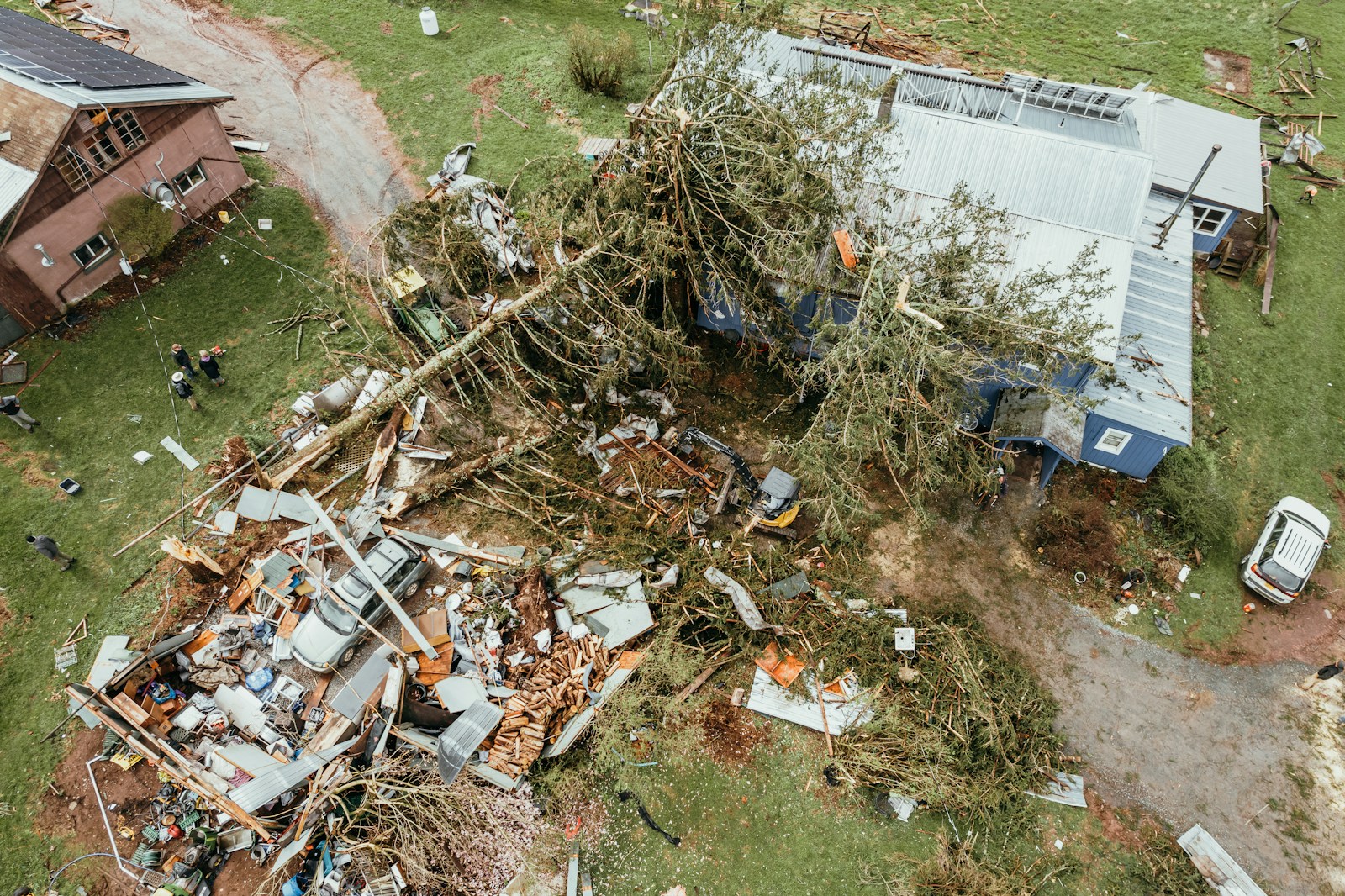 an aerial view of a house, that has been destroyed, property damage