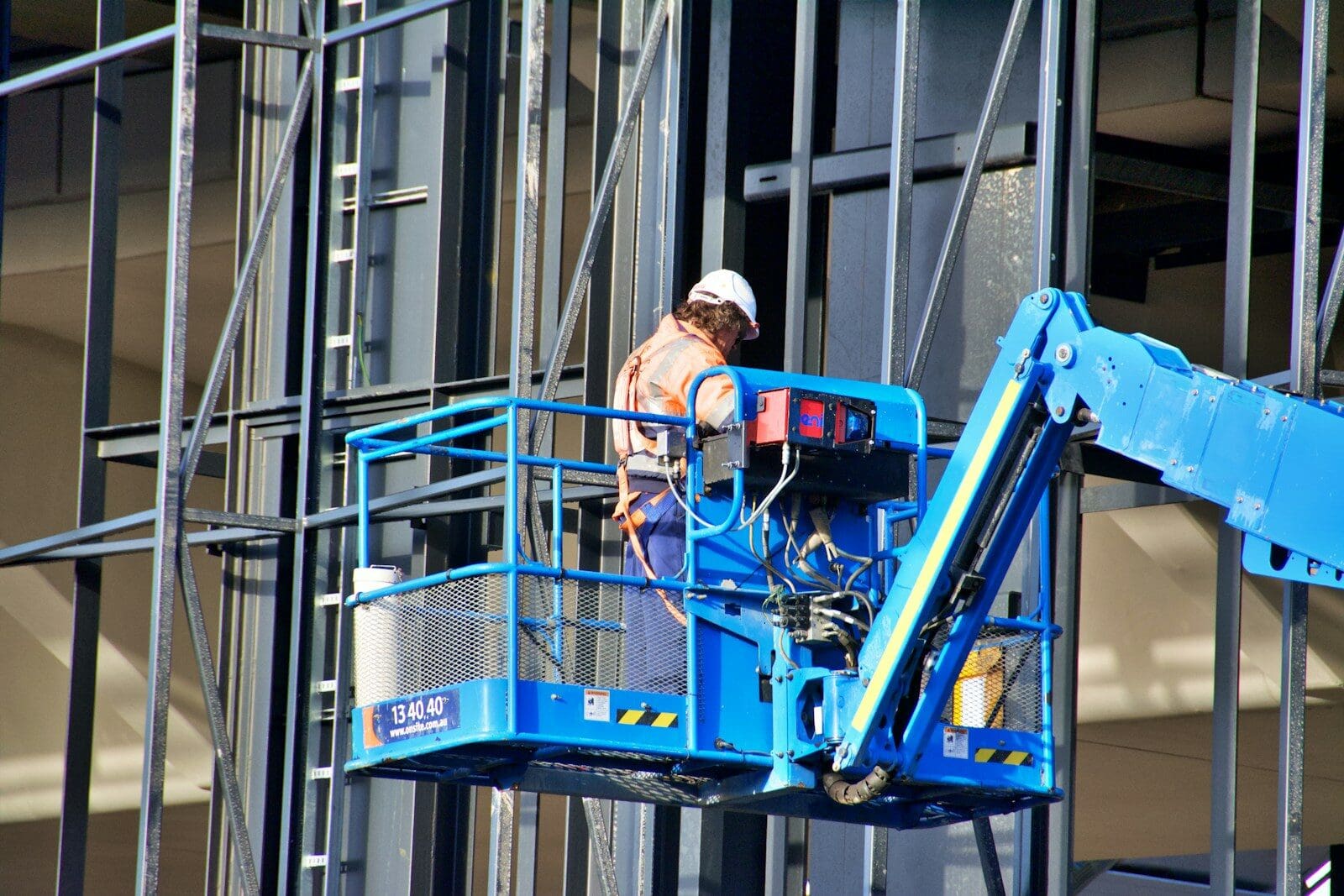 Construction worker on a lift at a building site